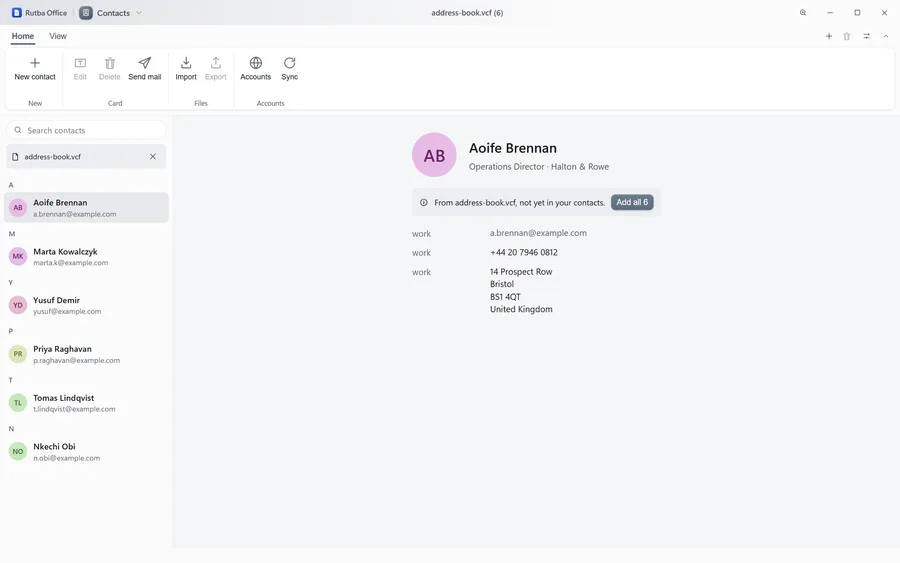 The Contacts app showing an address book grouped by initial with coloured monogram avatars, and a detail pane giving one person’s job title, organisation, work email, telephone number and postal address